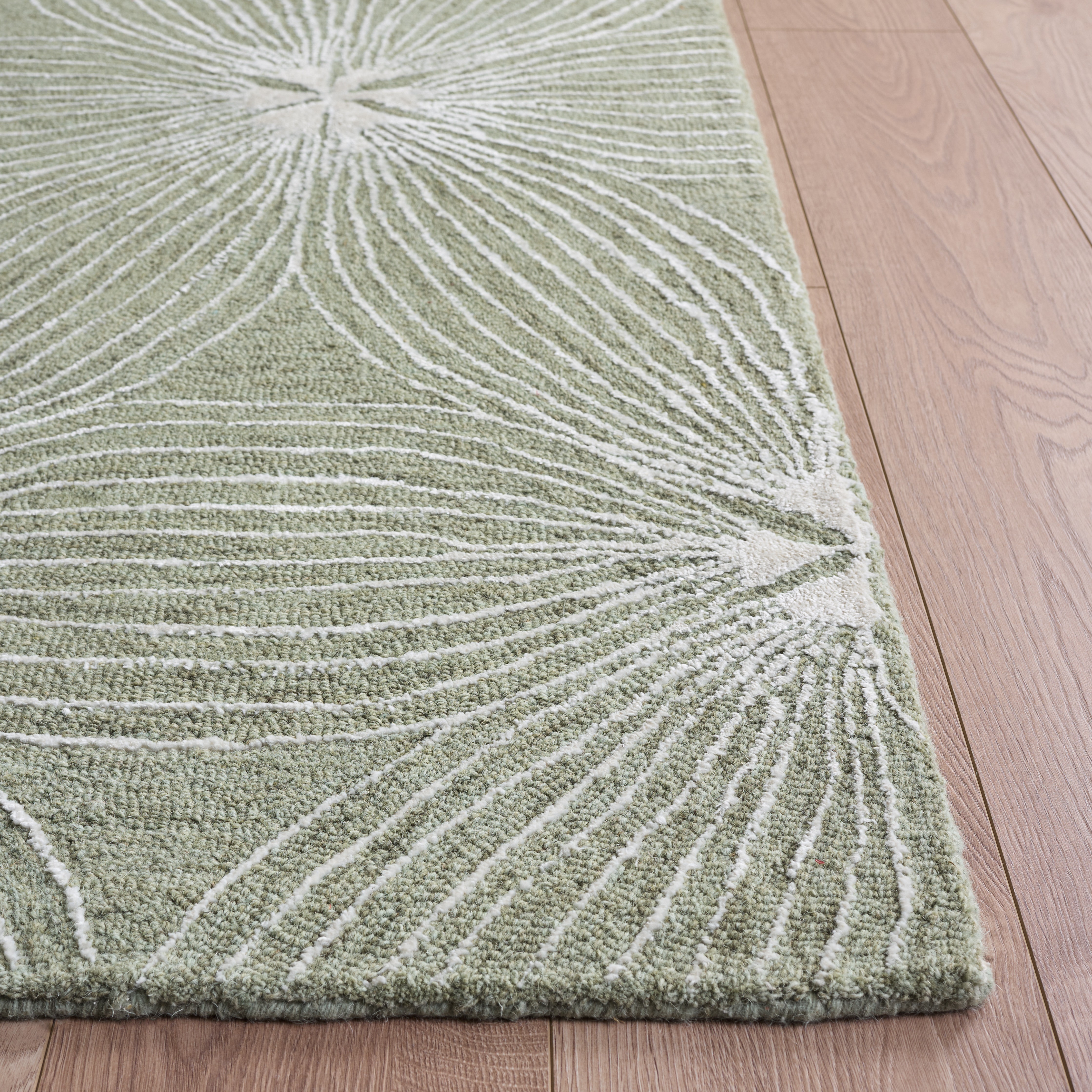 Glamour Floral Burst Hand-Tufted Rug in Sage / Ivory in a styled room